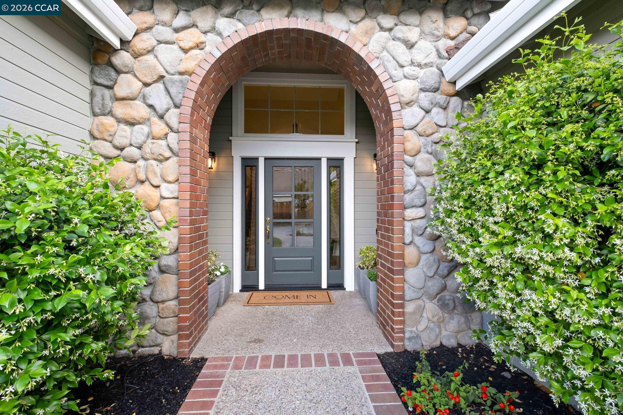 76 Rock Ridge Court Danville, CA 94526 - Photo 2 of 65 a front view of a house with a garden
