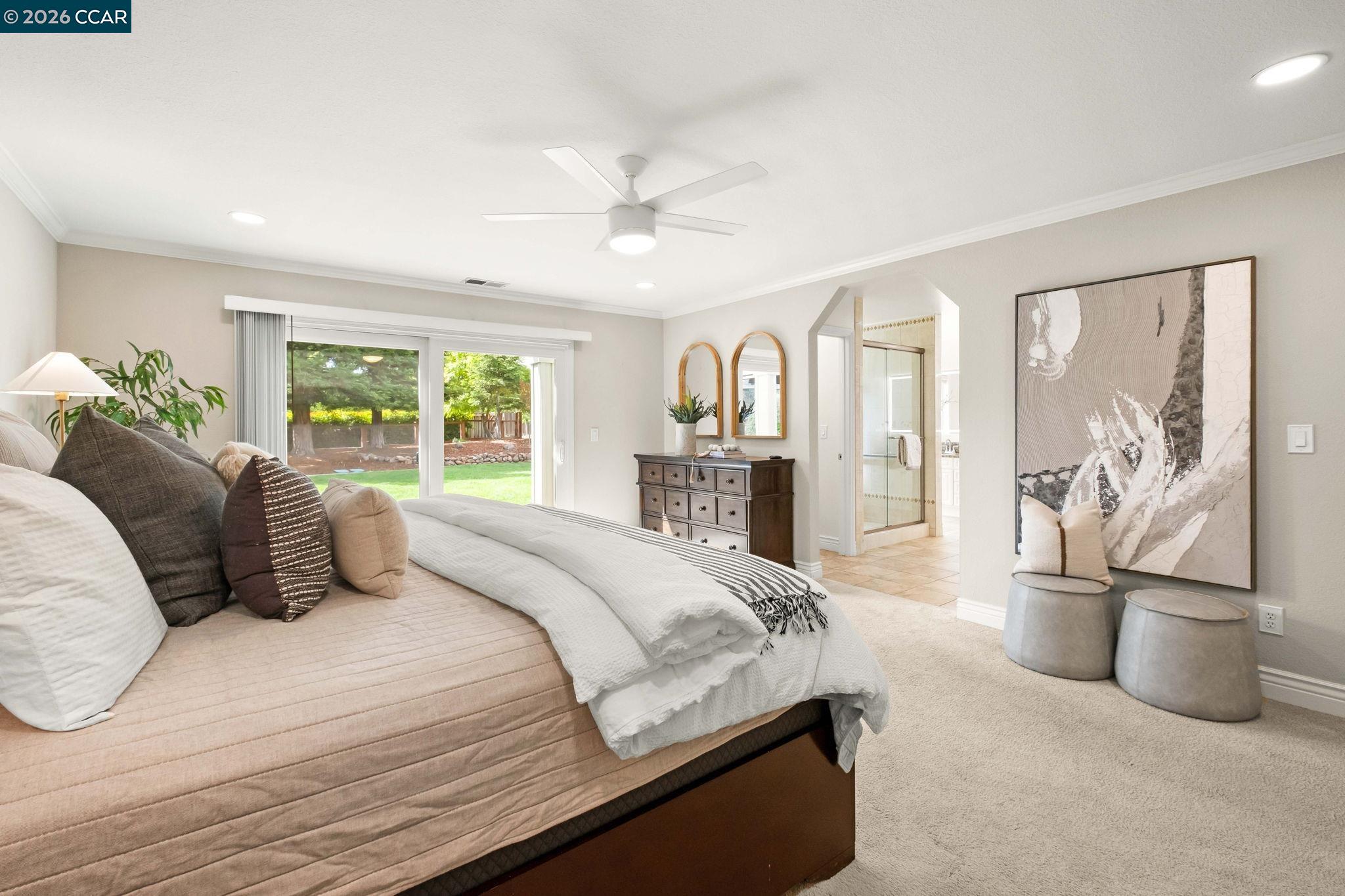 76 Rock Ridge Court Danville, CA 94526 - Photo 22 of 65 a bedroom with a large bed and a chandelier