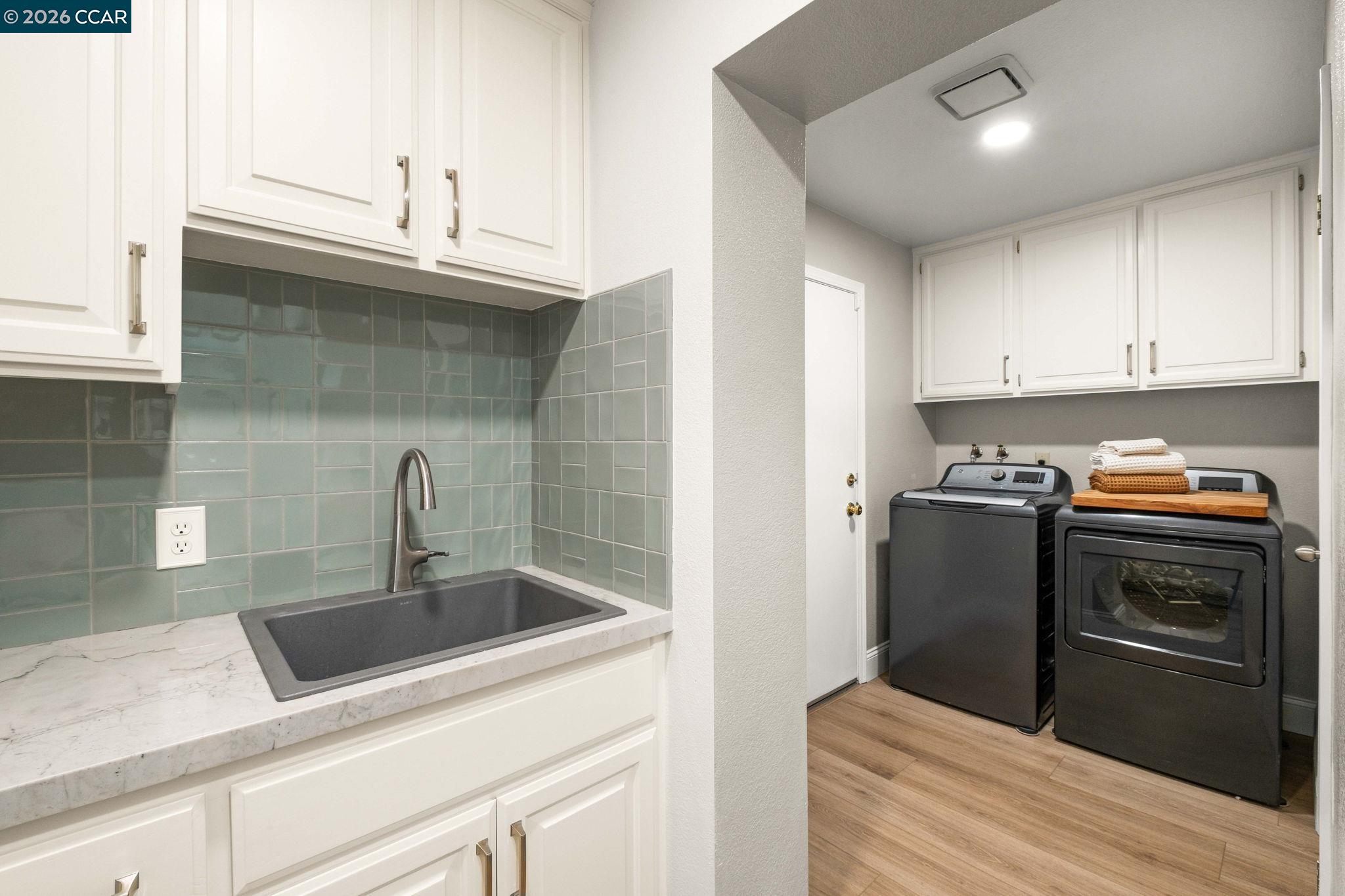 76 Rock Ridge Court Danville, CA 94526 - Photo 30 of 65 a kitchen with stainless steel appliances granite countertop a sink and a stove