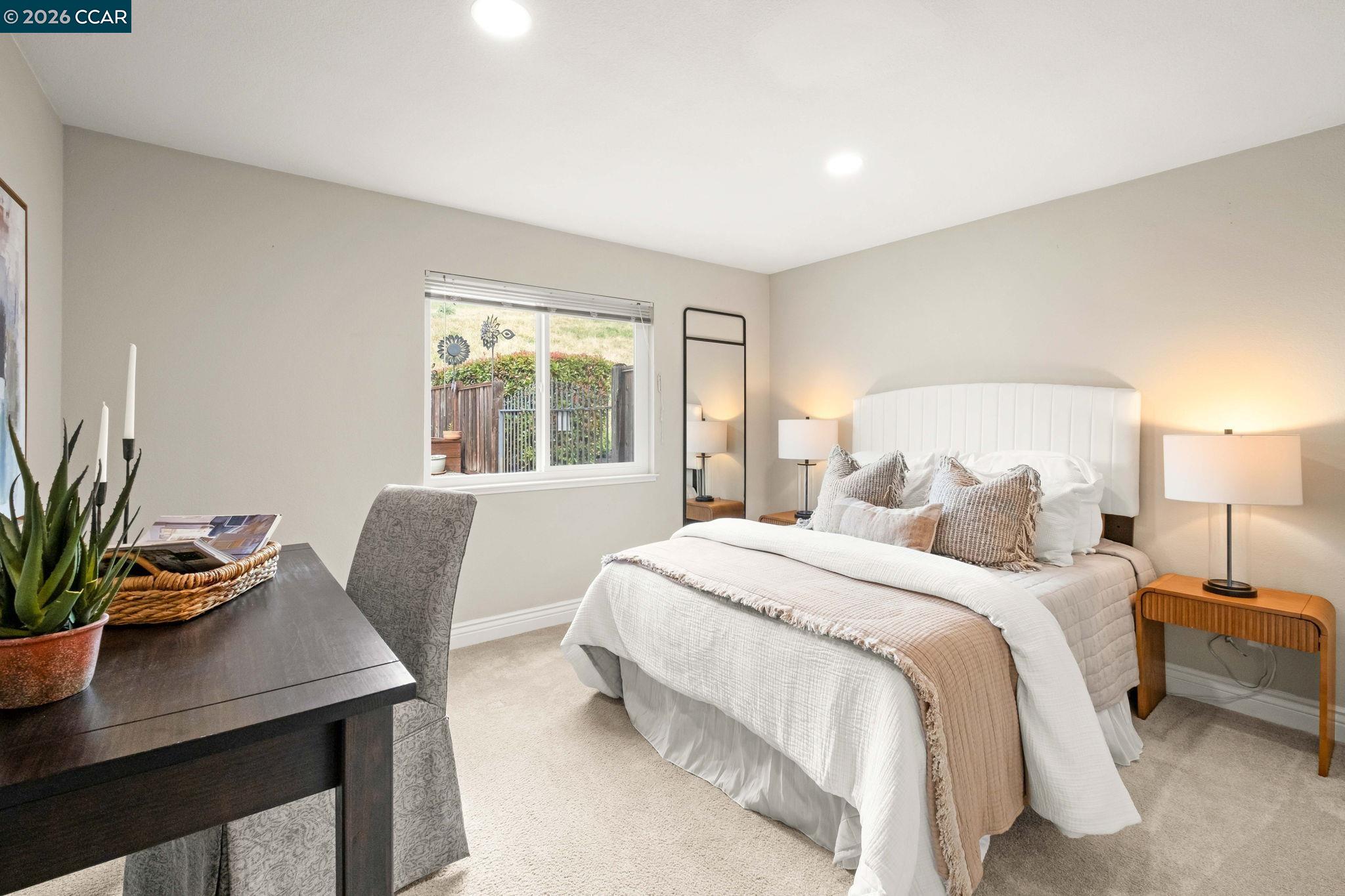 76 Rock Ridge Court Danville, CA 94526 - Photo 34 of 65 a bedroom with a bed window and table chair