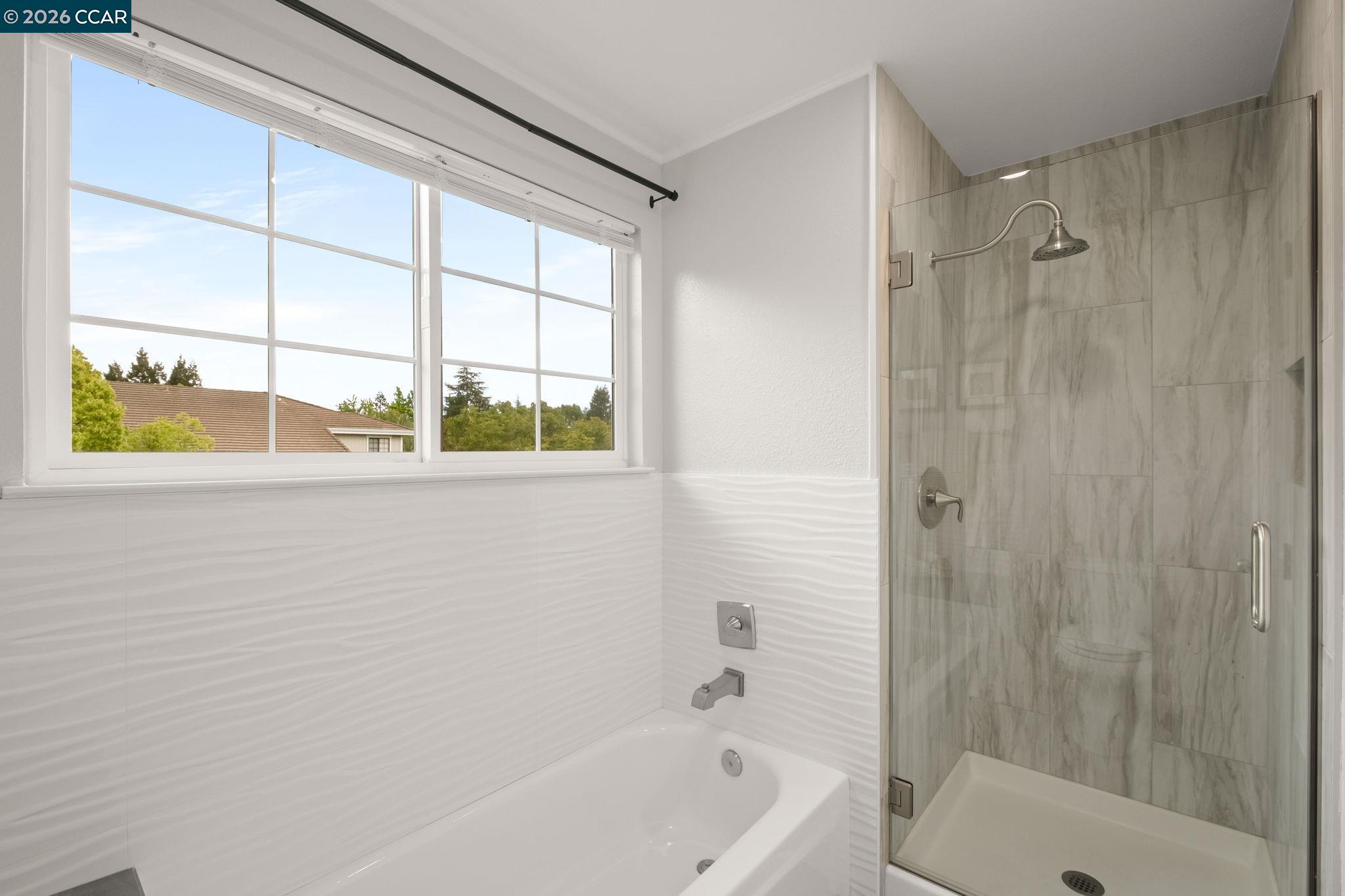 76 Rock Ridge Court Danville, CA 94526 - Photo 39 of 65 a bathroom with a bathtub and a shower