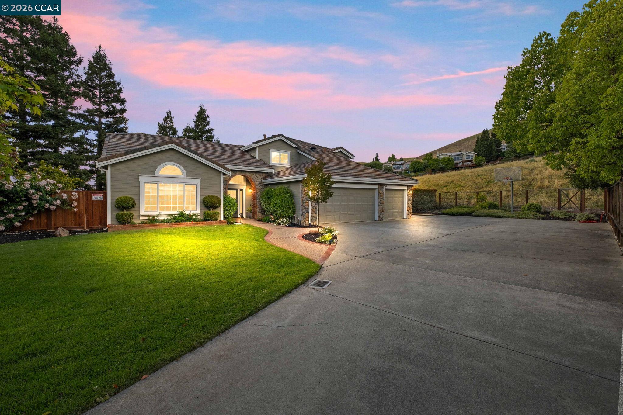 76 Rock Ridge Court Danville, CA 94526 - Photo 5 of 65 a view of a house with a big yard and large trees