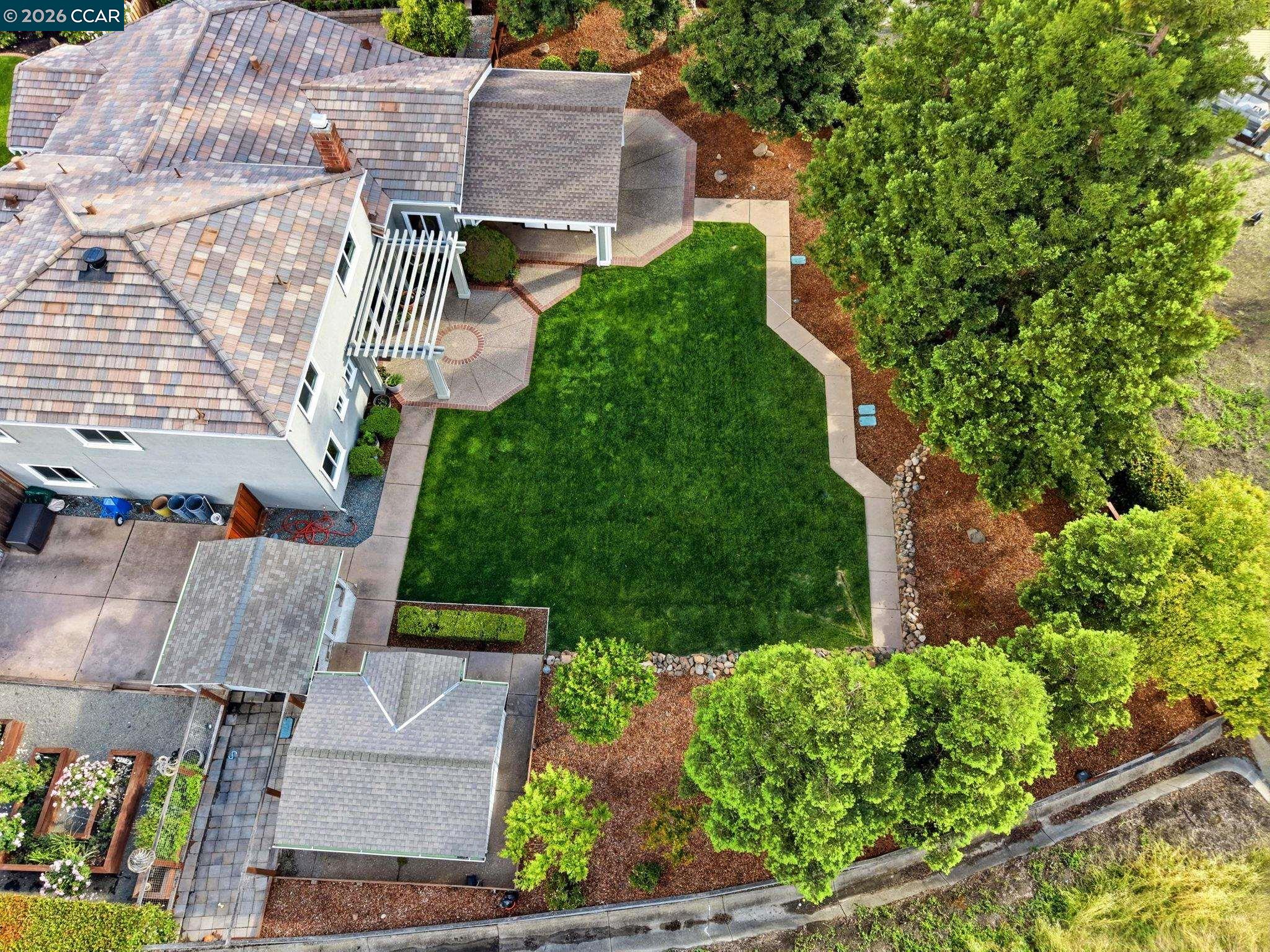 76 Rock Ridge Court Danville, CA 94526 - Photo 62 of 65 an aerial view of a house with a garden and plants