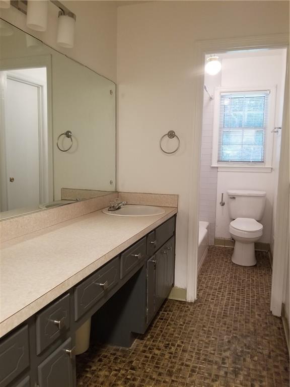 2467 Woodside Way Atlanta, GA 30341 - Photo 14 of 25 a bathroom with a sink and a mirror
