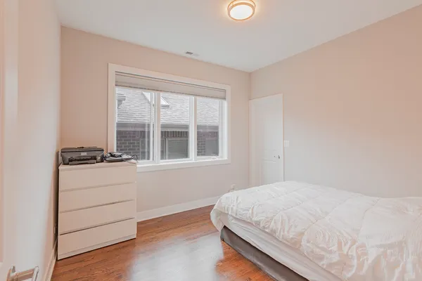 a room with a bed and a window