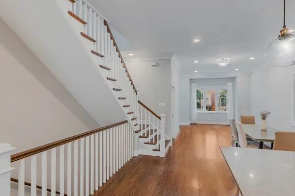 a living room with furniture and stairs