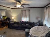 1319 Washington Street Huntingdon, PA 16652 - Photo 11 of 20 a living room with furniture and a chandelier