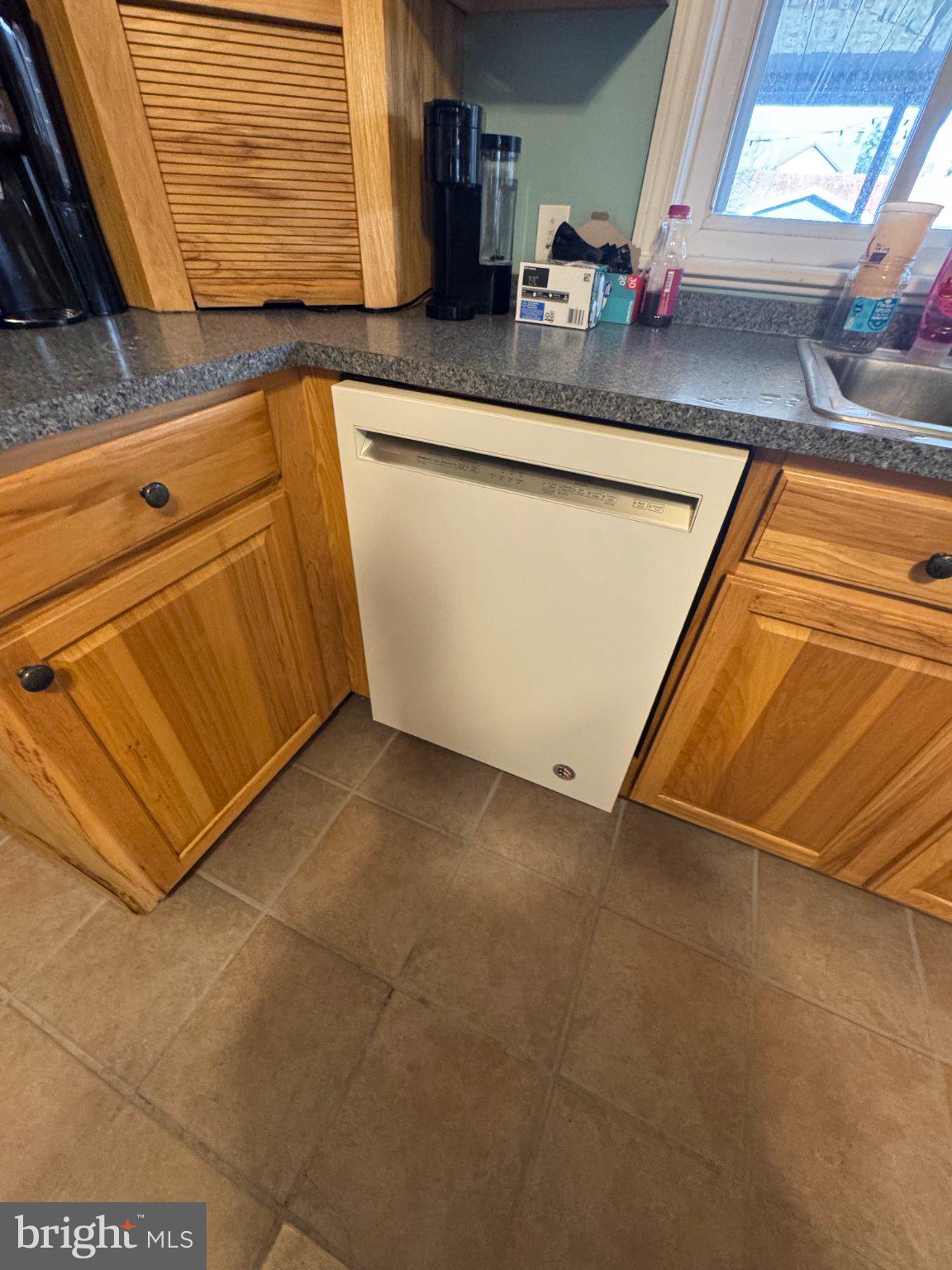 1319 Washington Street Huntingdon, PA 16652 - Photo 16 of 20 a kitchen with stainless steel appliances granite countertop a sink and a granite counter tops