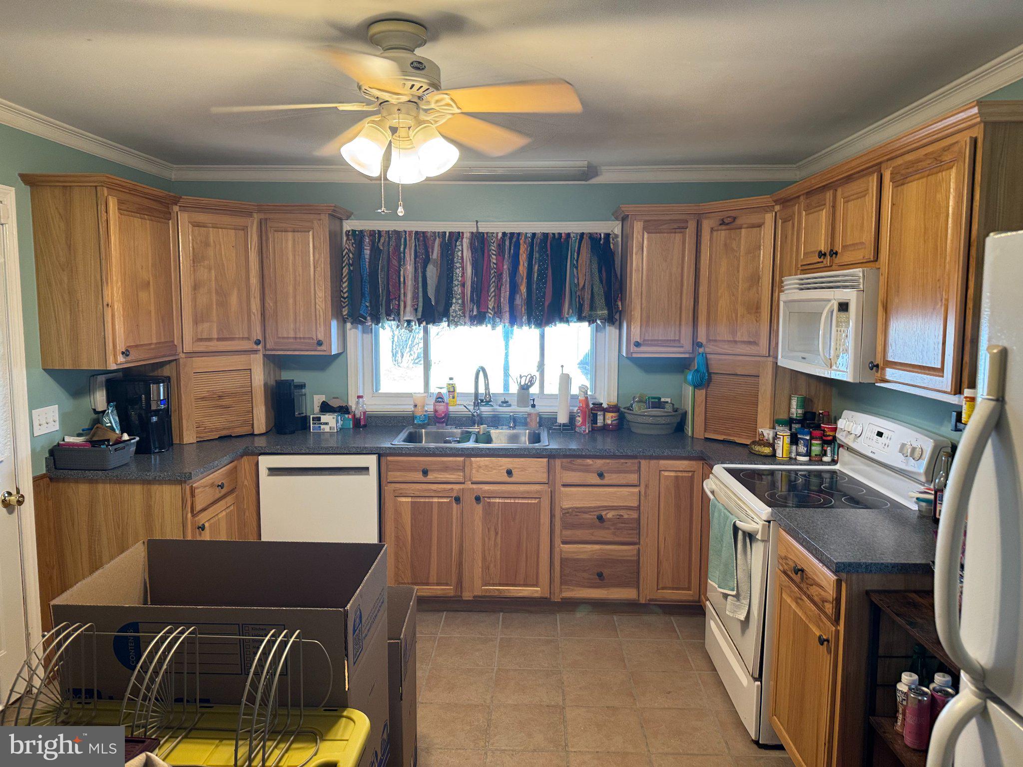 1319 Washington Street Huntingdon, PA 16652 - Photo 7 of 20 a kitchen with a sink stove and microwave
