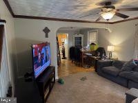 1319 Washington Street Huntingdon, PA 16652 - Photo 10 of 20 a living room with furniture and a flat screen tv