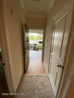 a view of hallway with windows