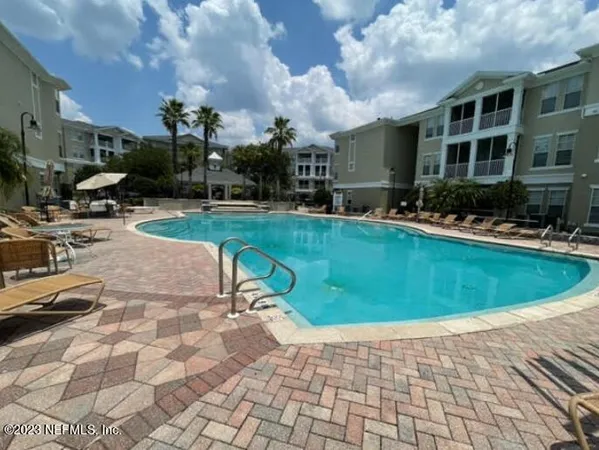 a view of a swimming pool with a patio
