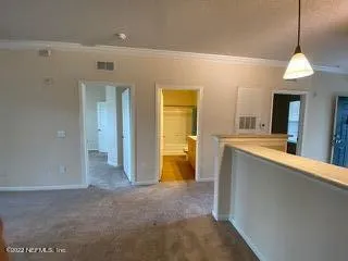 a view of a kitchen with a sink and cabinets