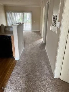 a view of entryway with kitchen