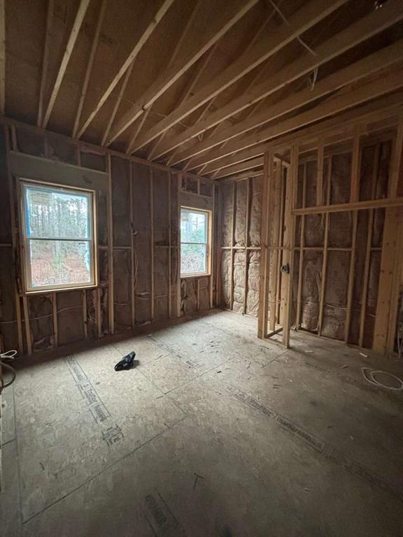 2601 Gees Mill Road Northeast Conyers, GA 30013 - Photo 5 of 11 a view of an empty room with a fireplace and a window