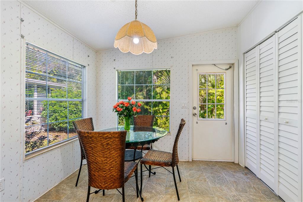 509 Starboard Avenue Edgewater, FL 32141 - Photo 14 of 54 a dining room with furniture and window