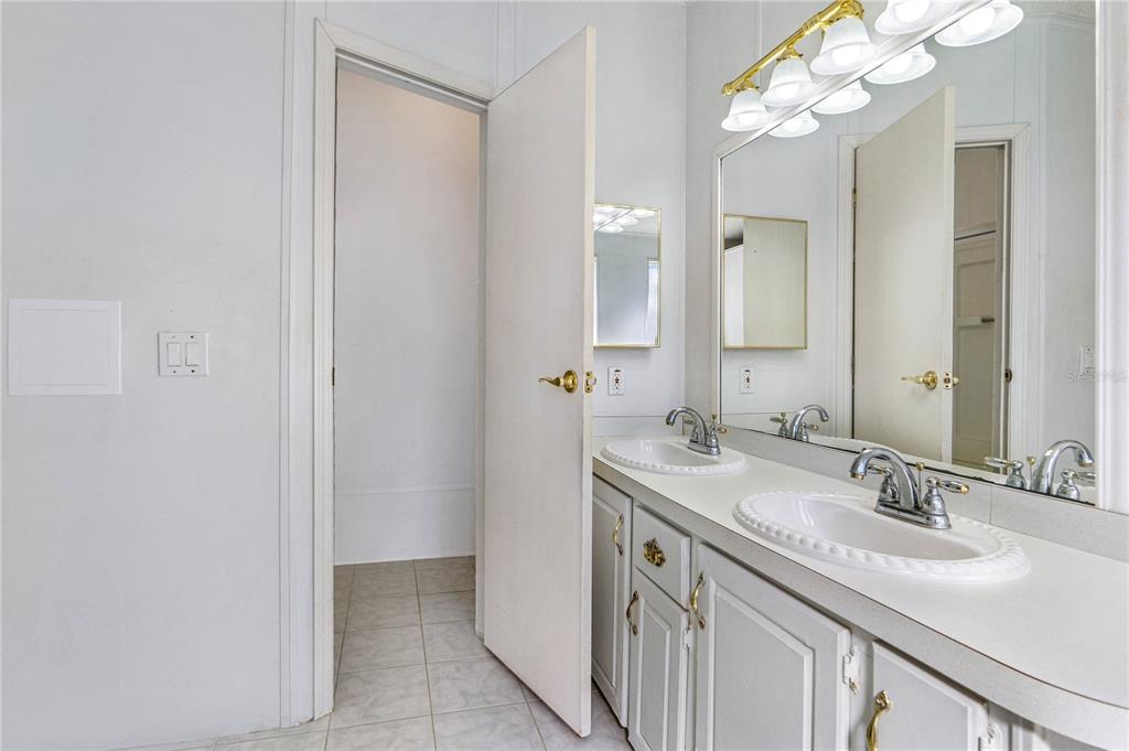 509 Starboard Avenue Edgewater, FL 32141 - Photo 21 of 54 a bathroom with a sink and a mirror