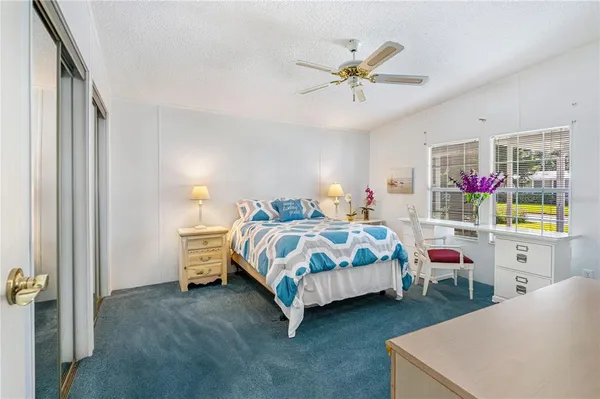 a bedroom with a bed and dresser