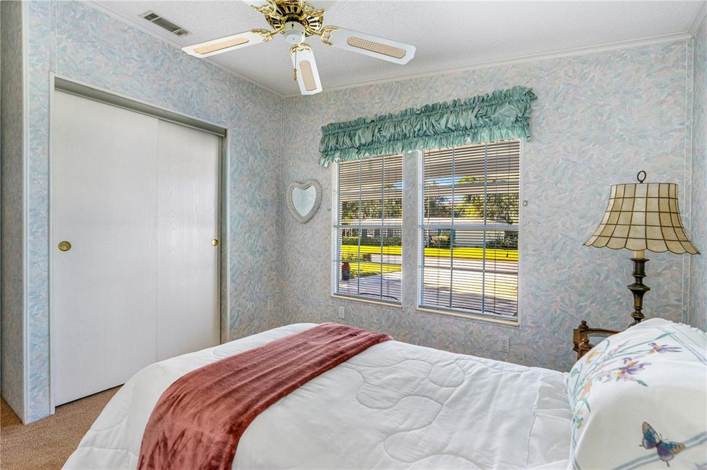 509 Starboard Avenue Edgewater, FL 32141 - Photo 27 of 54 a bedroom with a bed and a window