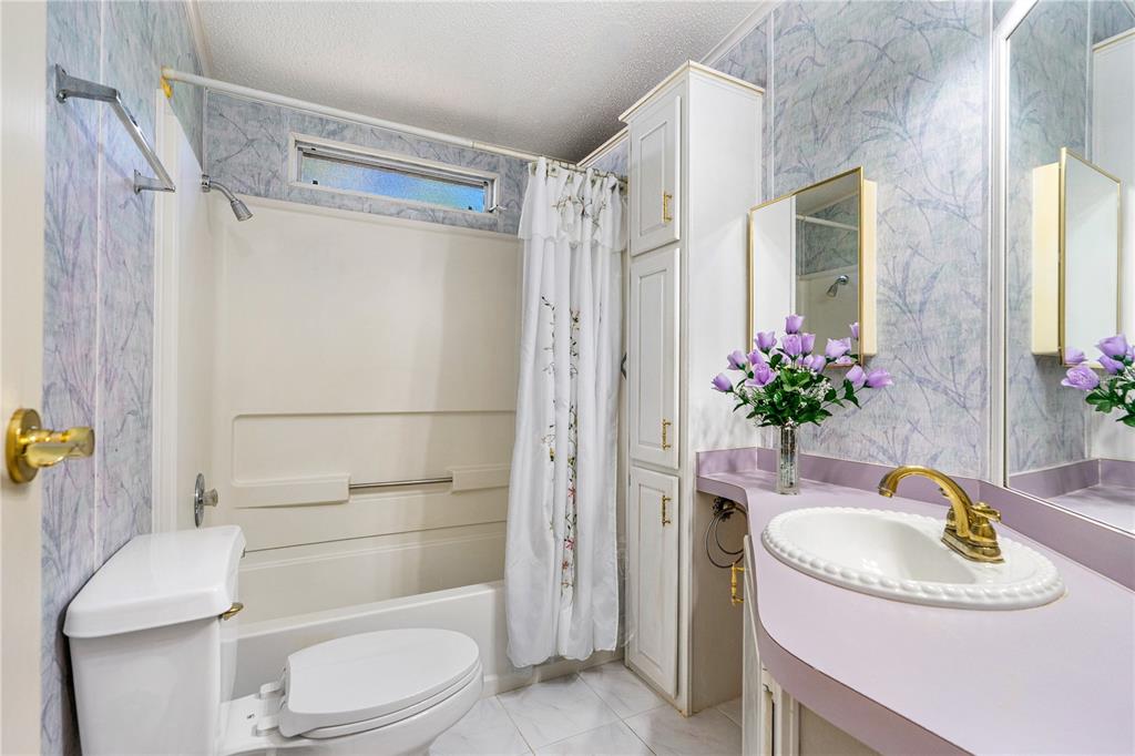 509 Starboard Avenue Edgewater, FL 32141 - Photo 28 of 54 a bathroom with a sink toilet and shower