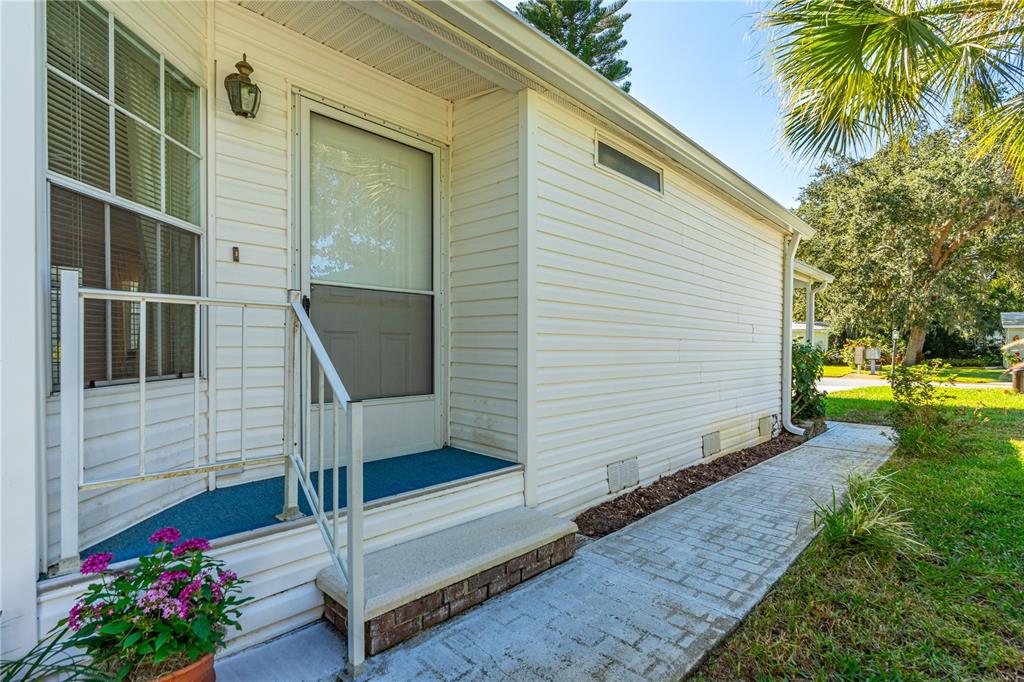509 Starboard Avenue Edgewater, FL 32141 - Photo 34 of 54 a front view of a house with a yard
