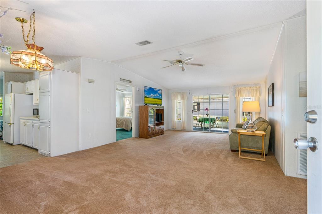 509 Starboard Avenue Edgewater, FL 32141 - Photo 6 of 54 a view of a livingroom with furniture and windows