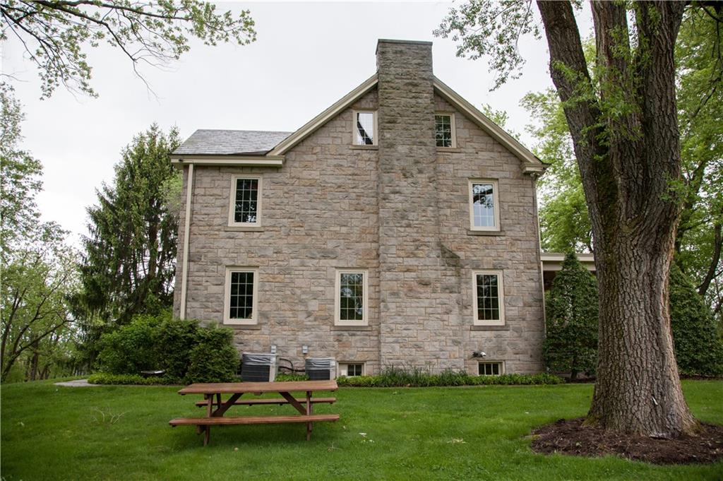 312 Harmony Road Pittsburgh, PA 15237 - Photo 4 of 25 The original stone exterior and slate roof remain. New Pella windows, copper box gutters and copper rear porch roof are all beautiful compliments to the original.