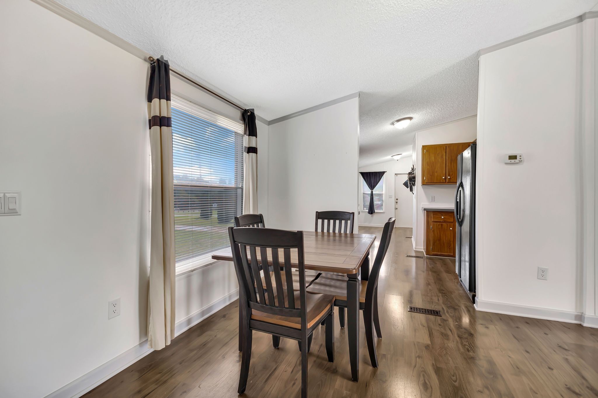 9440 Missionary Ridge Road Bon Aqua, TN 37025 - Photo 11 of 59 a view of a dining room with furniture and wooden floor