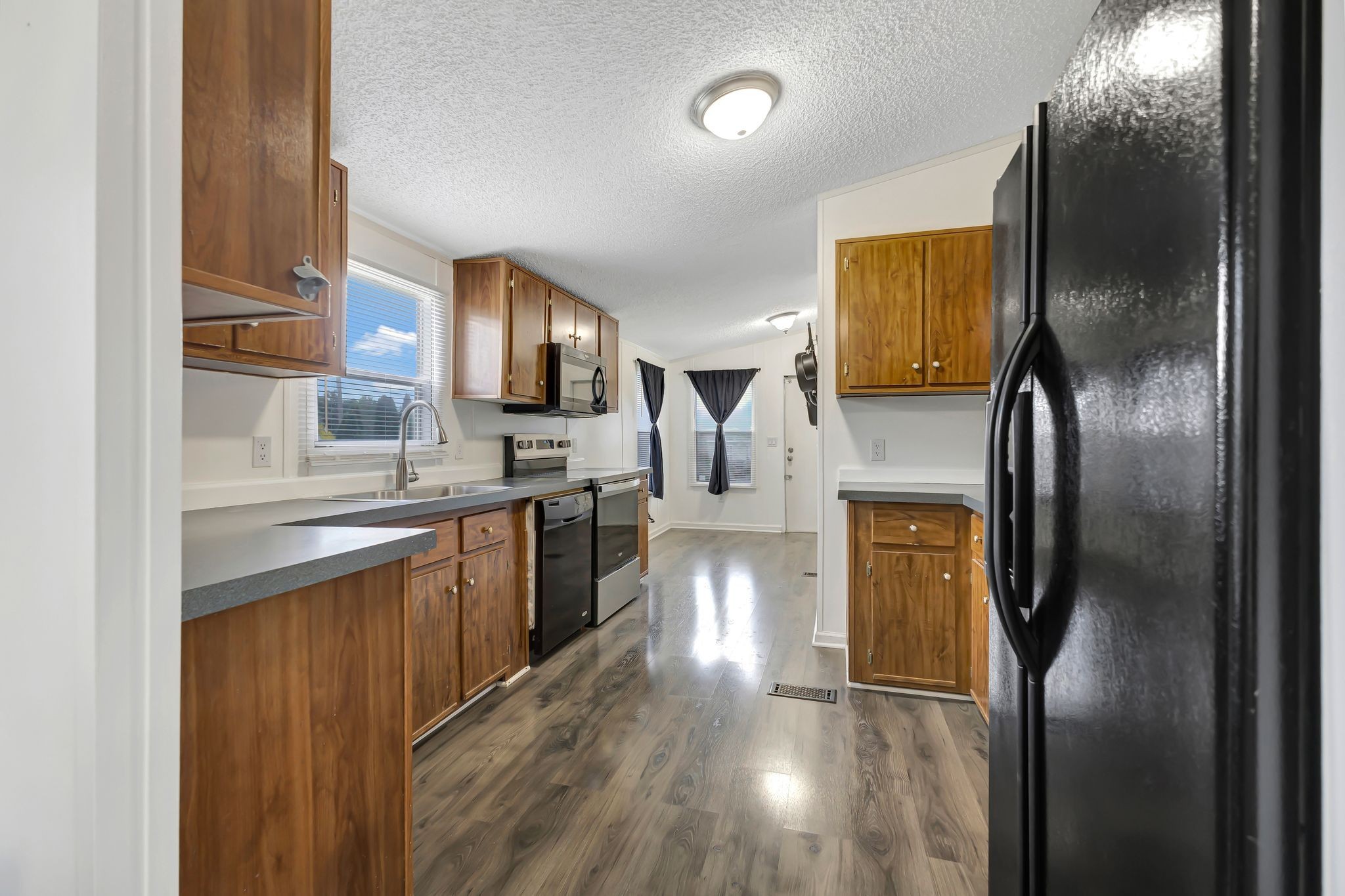 9440 Missionary Ridge Road Bon Aqua, TN 37025 - Photo 13 of 59 a kitchen with stainless steel appliances granite countertop a refrigerator a sink and a stove