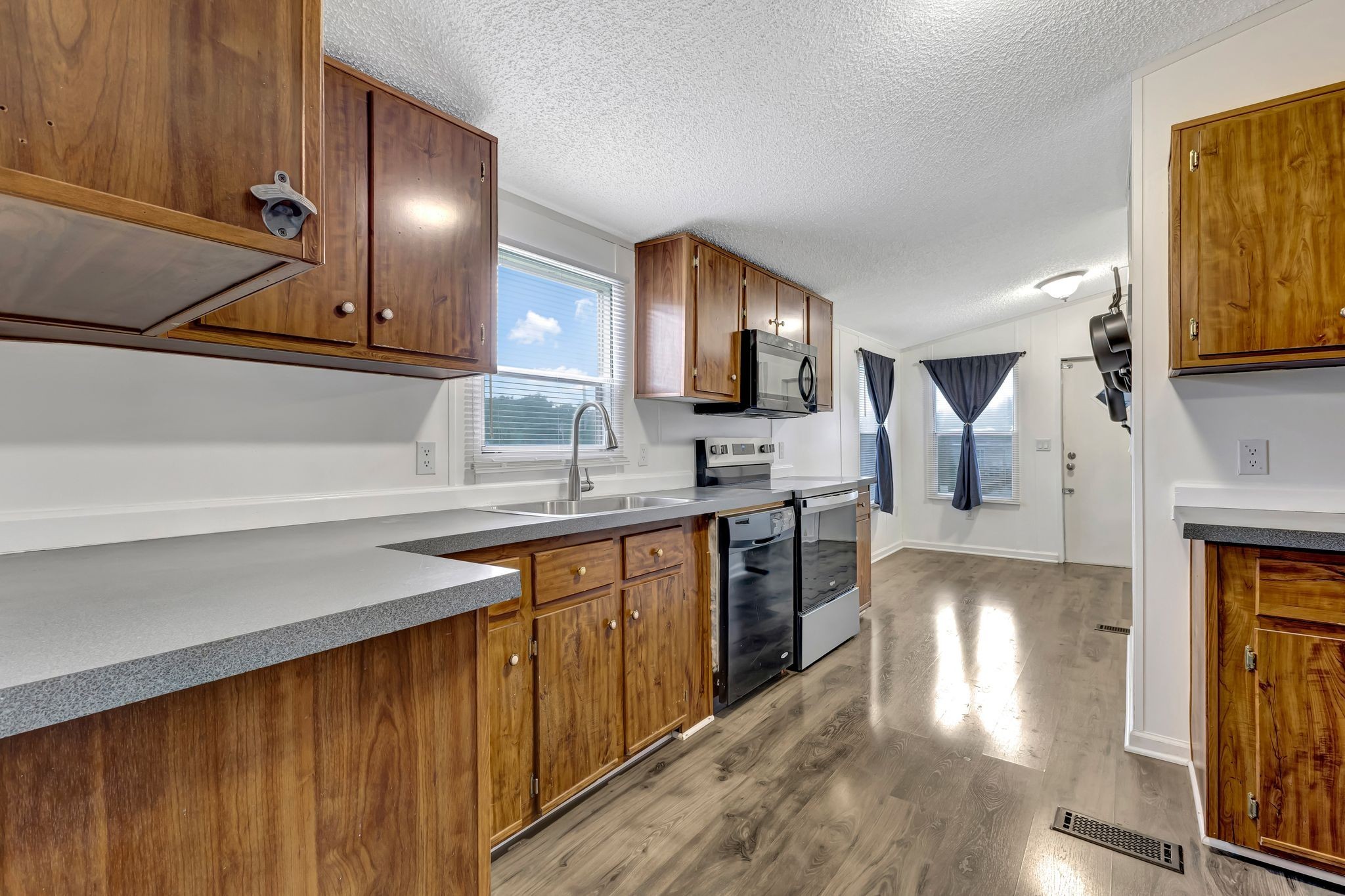 9440 Missionary Ridge Road Bon Aqua, TN 37025 - Photo 14 of 59 a kitchen with sink cabinets and outdoor view