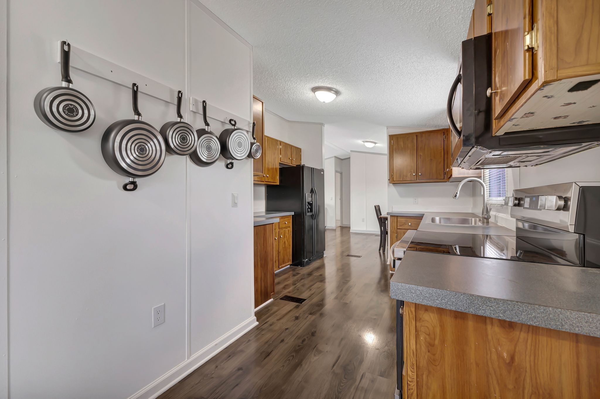 9440 Missionary Ridge Road Bon Aqua, TN 37025 - Photo 15 of 59 a kitchen with stainless steel appliances granite countertop a sink and a microwave