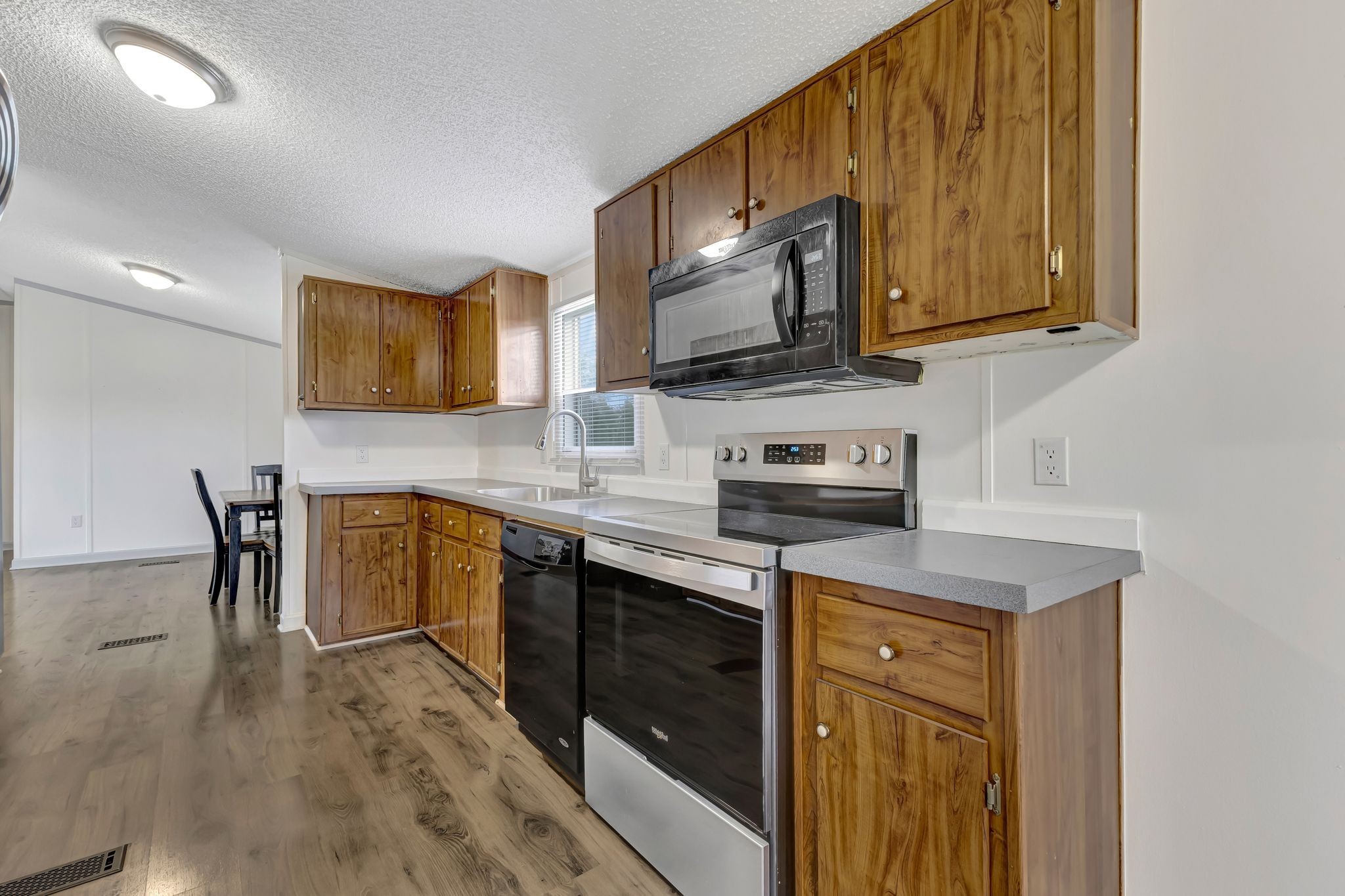 9440 Missionary Ridge Road Bon Aqua, TN 37025 - Photo 16 of 59 a kitchen with stainless steel appliances granite countertop wooden cabinets a stove top oven a sink and dishwasher