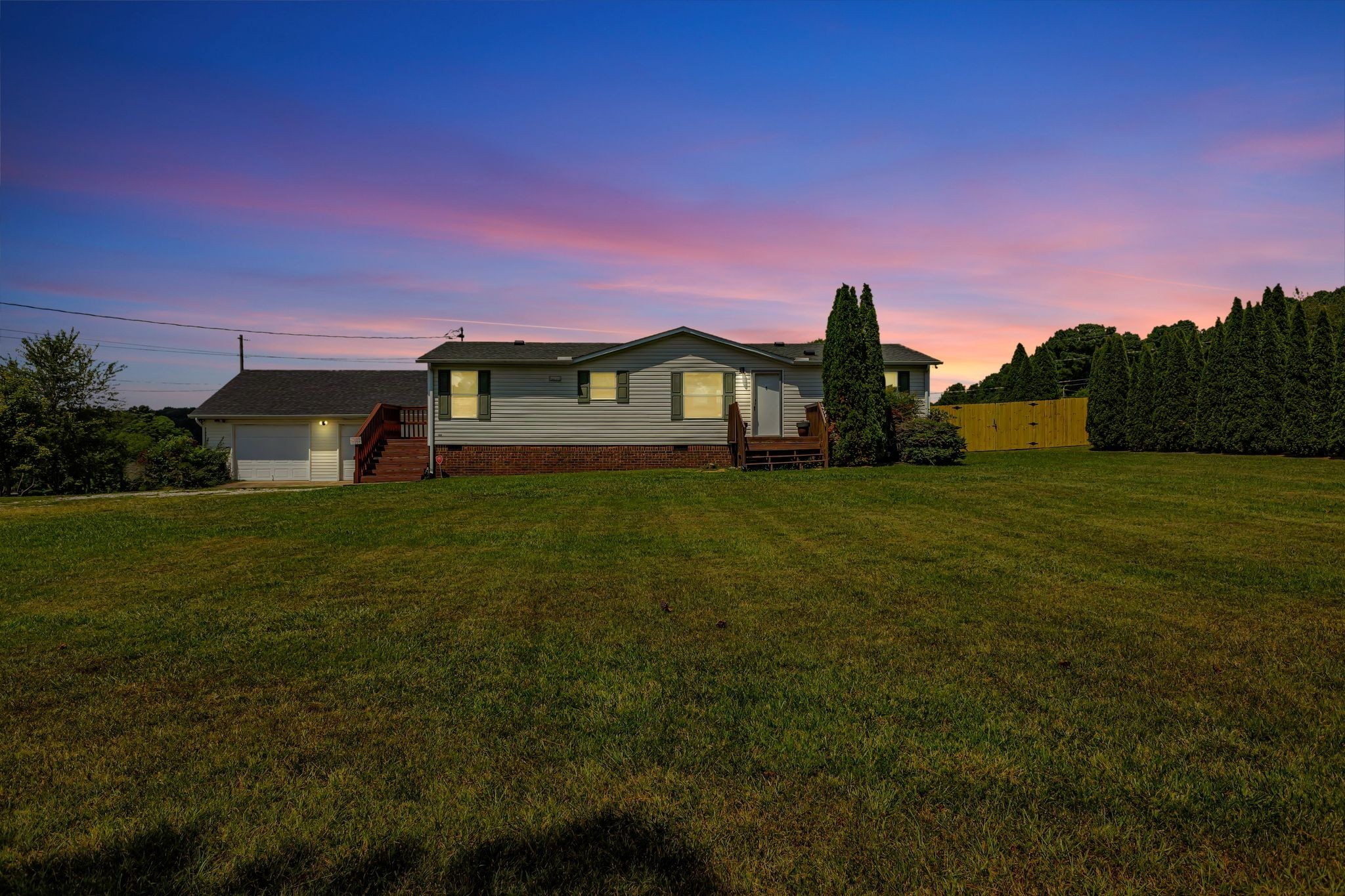 9440 Missionary Ridge Road Bon Aqua, TN 37025 - Photo 2 of 59 a front view of a house with a yard