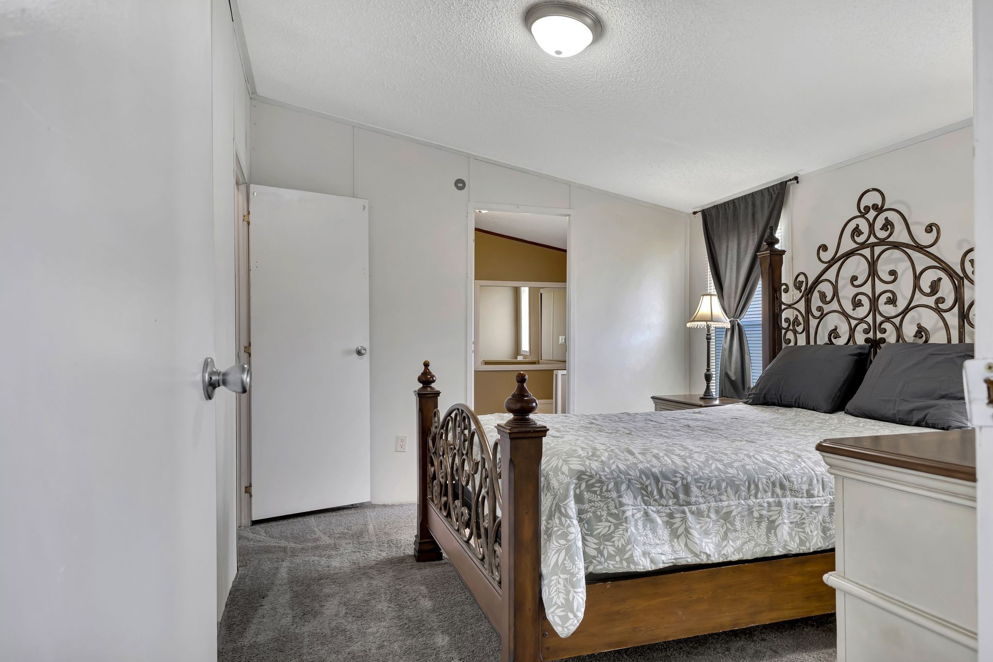 9440 Missionary Ridge Road Bon Aqua, TN 37025 - Photo 21 of 59 a bedroom with a bed and wooden floor