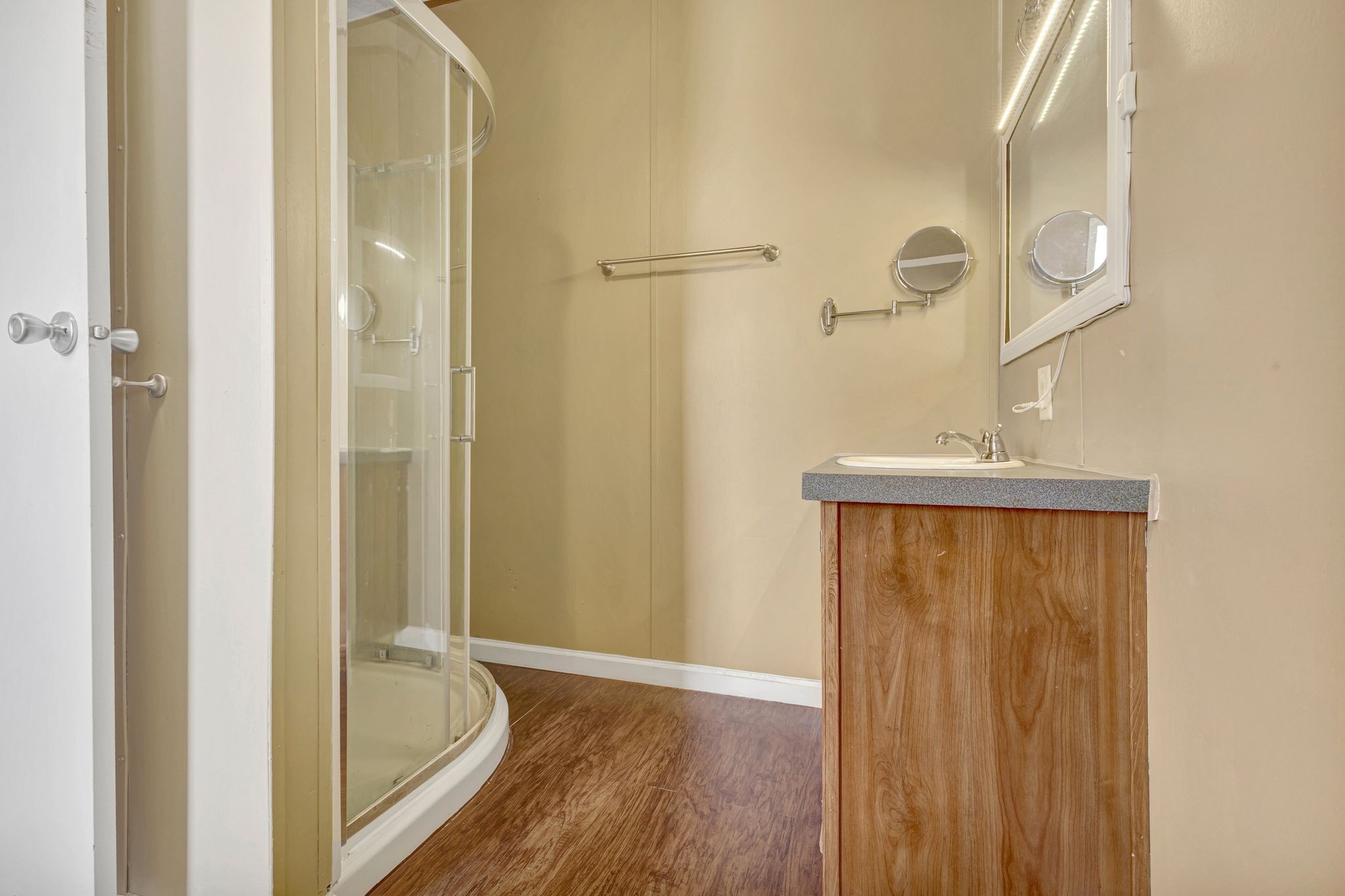 9440 Missionary Ridge Road Bon Aqua, TN 37025 - Photo 25 of 59 a bathroom with a granite countertop shower and a sink