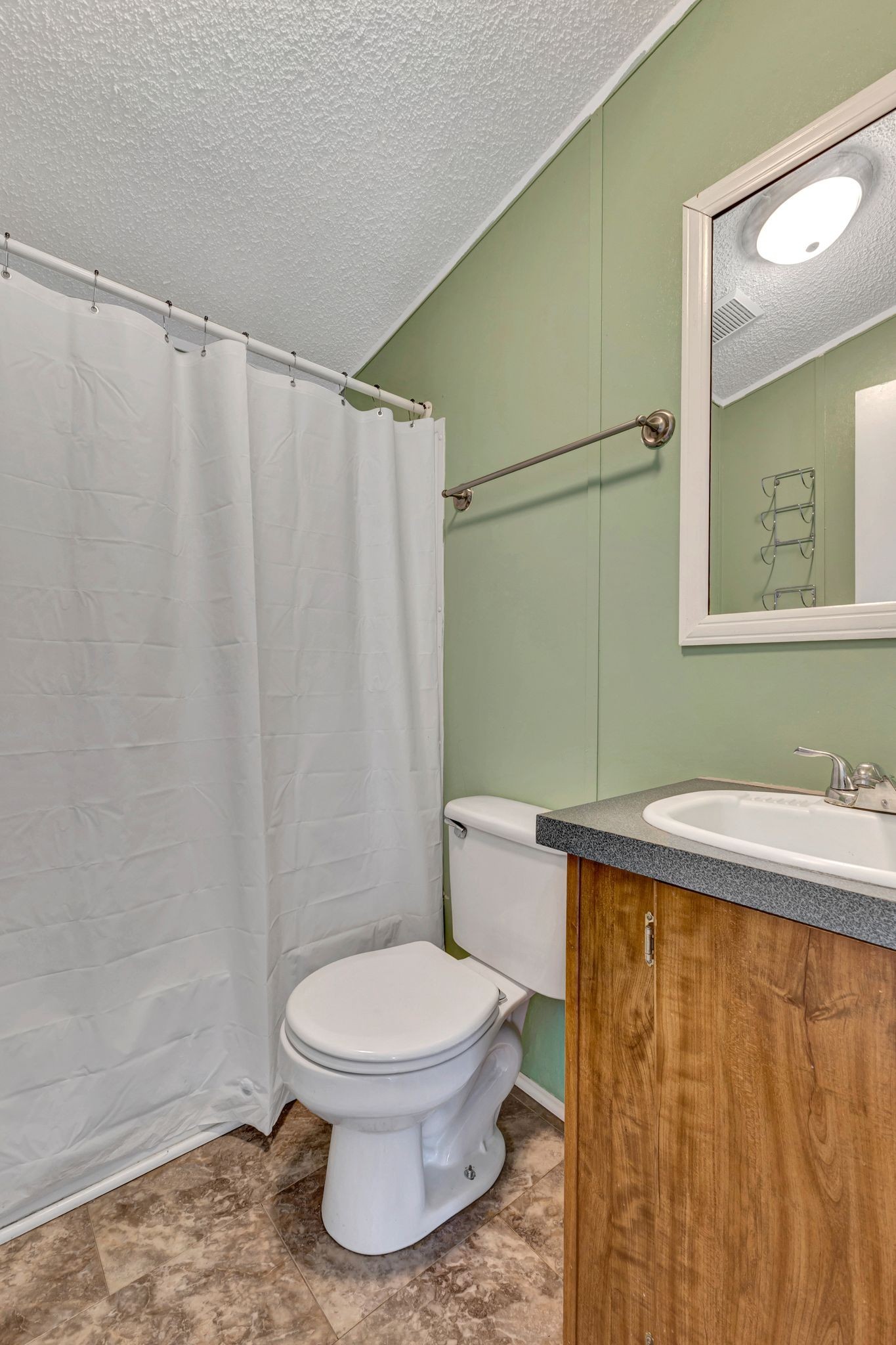 9440 Missionary Ridge Road Bon Aqua, TN 37025 - Photo 29 of 59 a bathroom with a toilet a sink and a shower