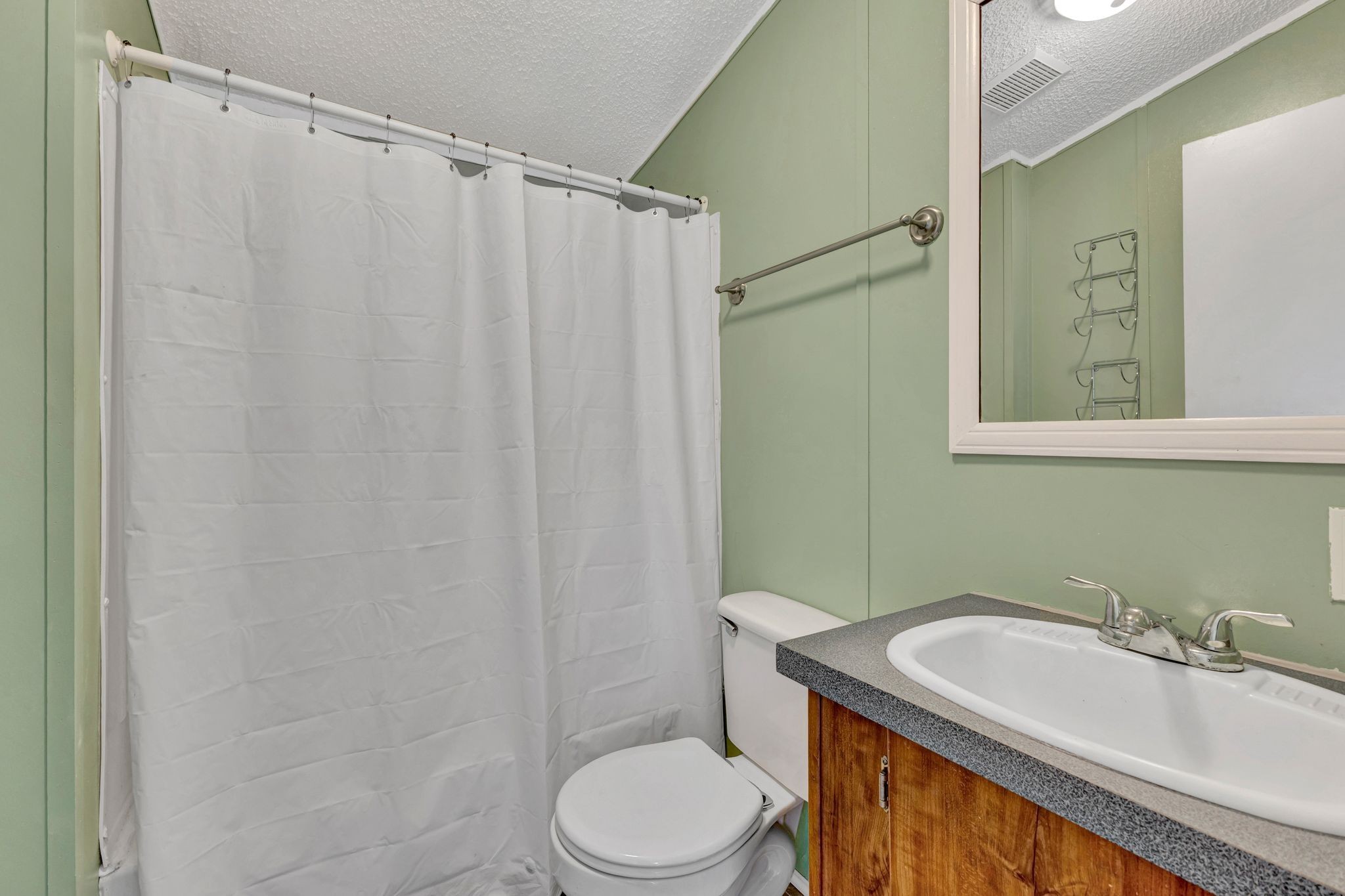 9440 Missionary Ridge Road Bon Aqua, TN 37025 - Photo 30 of 59 a bathroom with a sink toilet and shower