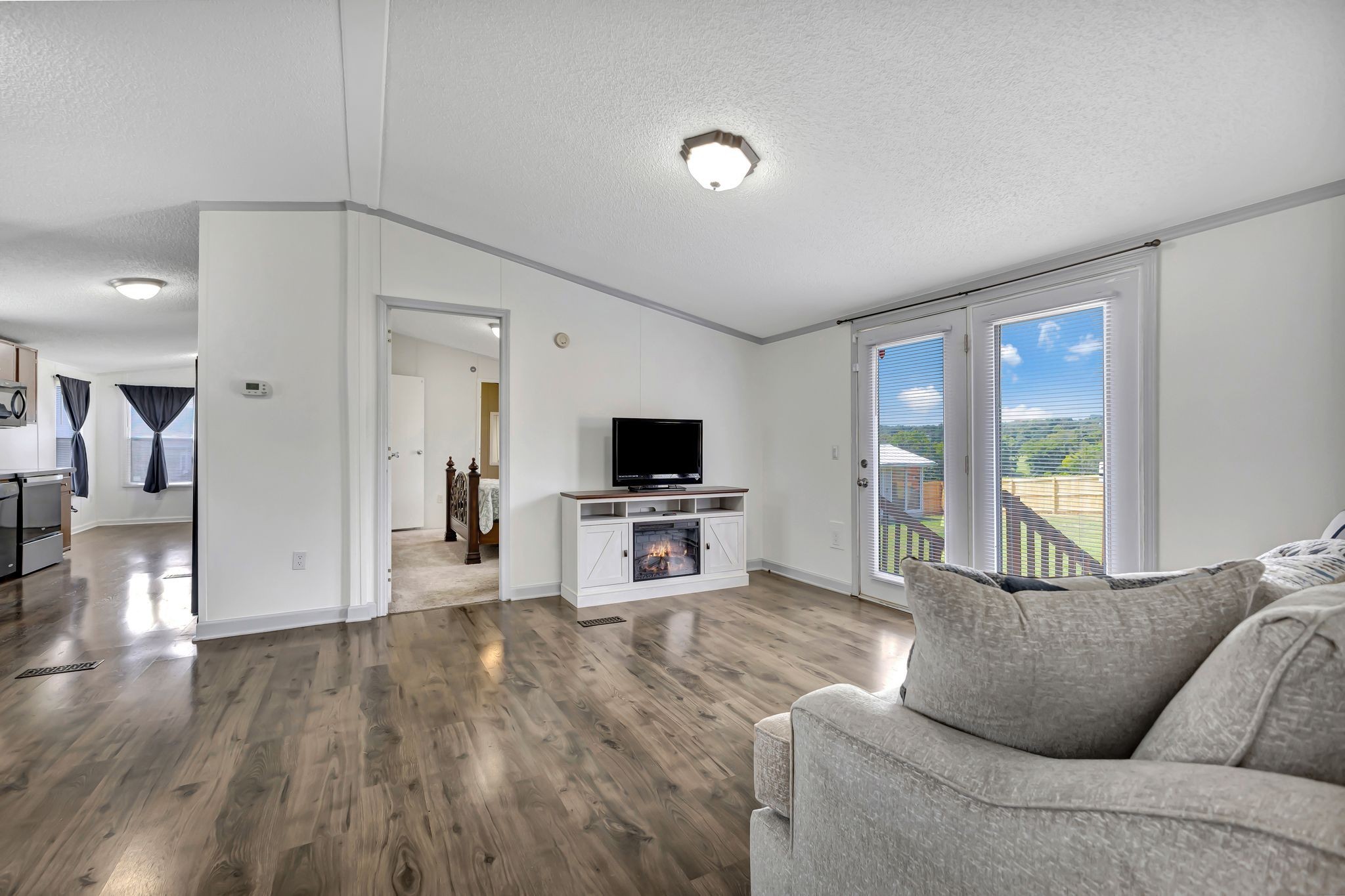 9440 Missionary Ridge Road Bon Aqua, TN 37025 - Photo 3 of 59 a living room with furniture and a flat screen tv
