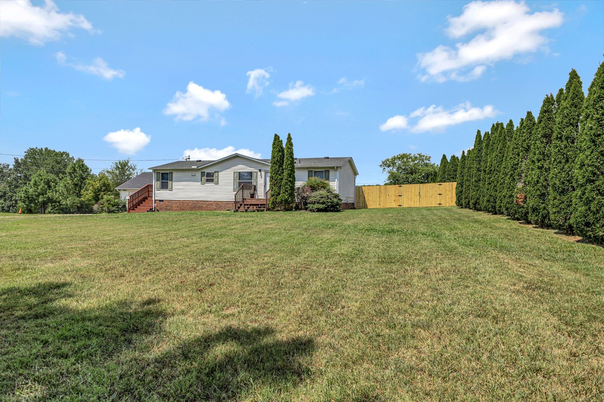 9440 Missionary Ridge Road Bon Aqua, TN 37025 - Photo 43 of 59 a view of a house with a big yard and a large tree