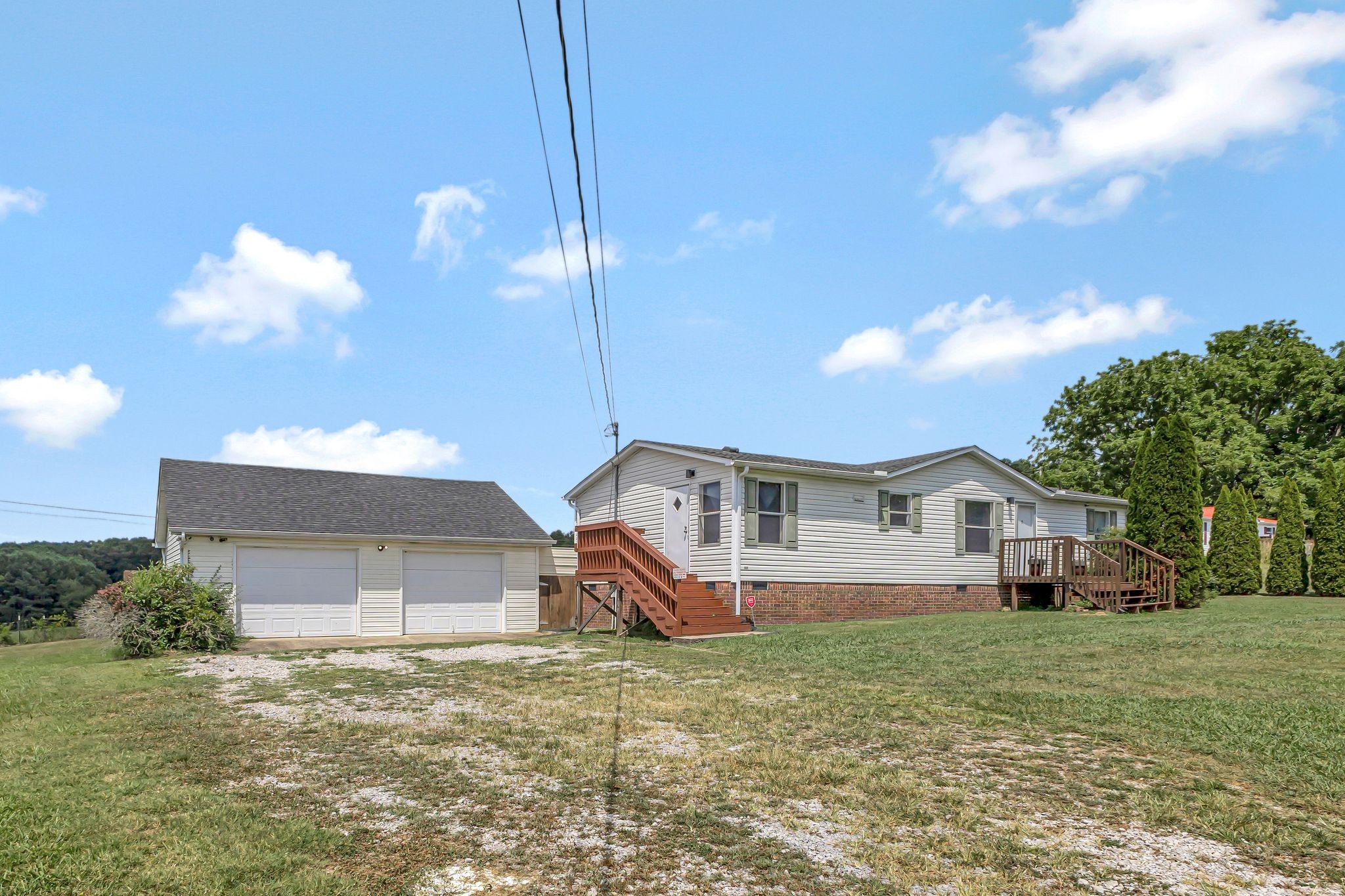 9440 Missionary Ridge Road Bon Aqua, TN 37025 - Photo 45 of 59 a front view of a house with a yard