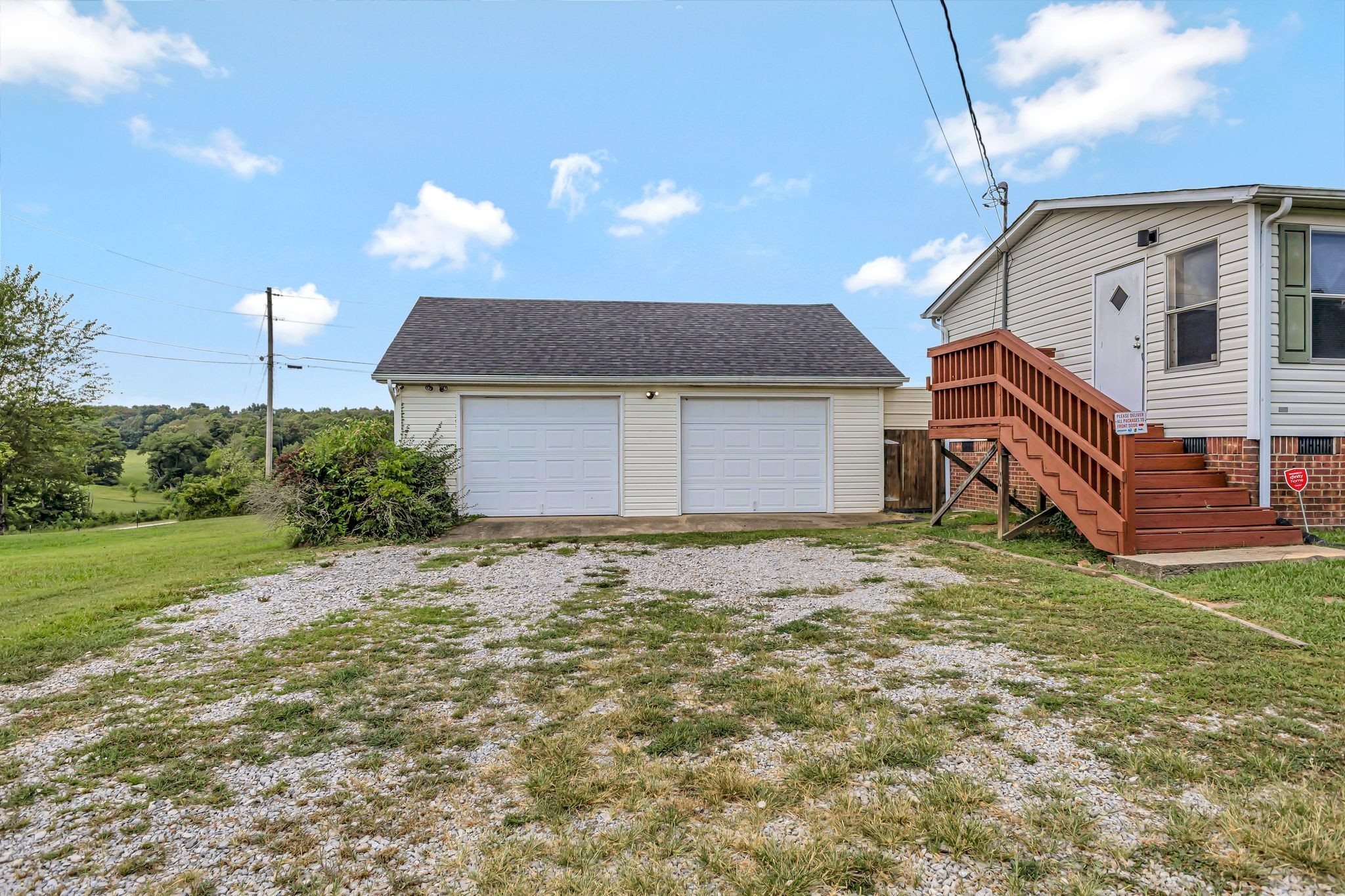 9440 Missionary Ridge Road Bon Aqua, TN 37025 - Photo 46 of 59 a backyard of a house with wooden fence