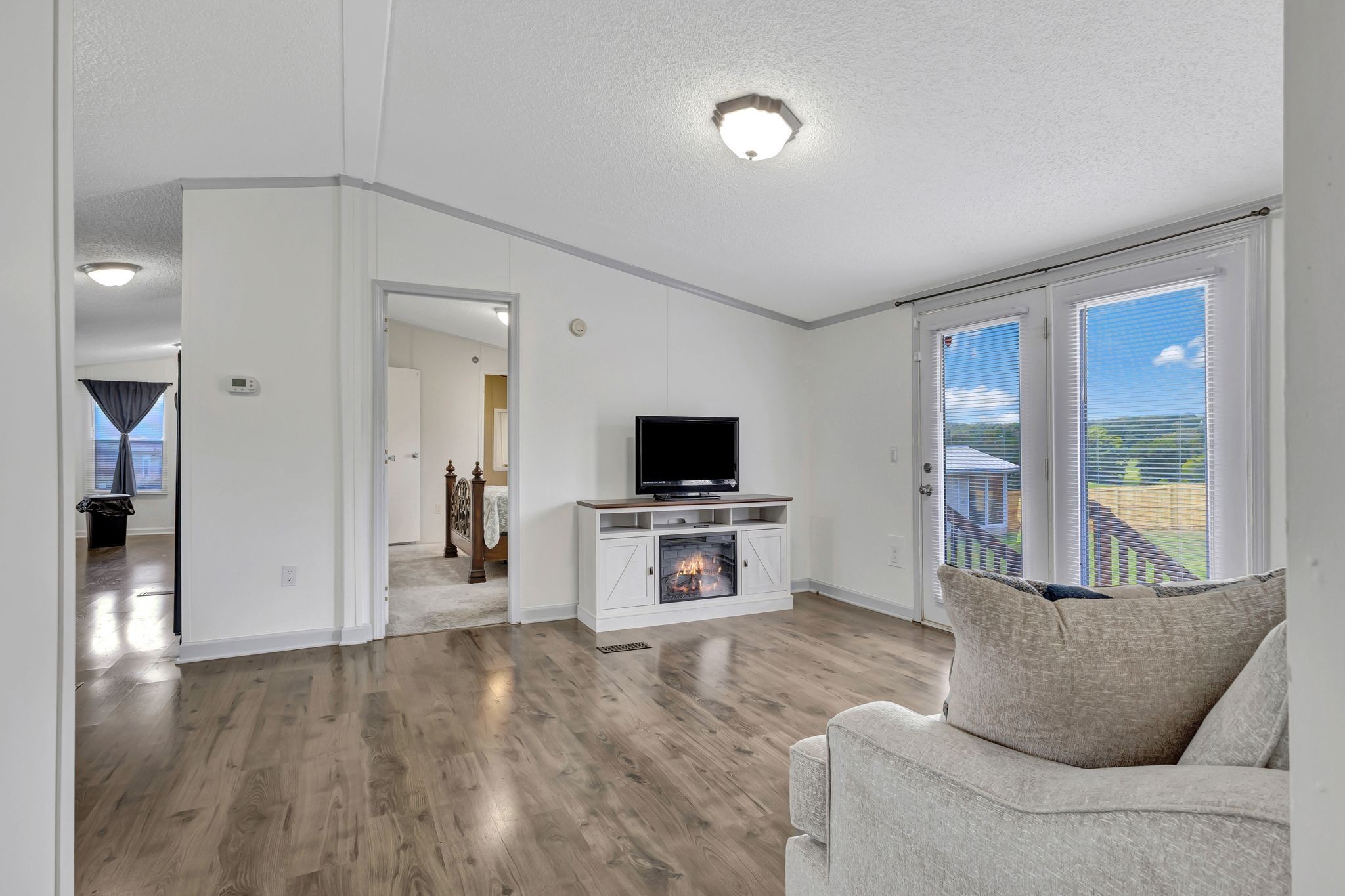 9440 Missionary Ridge Road Bon Aqua, TN 37025 - Photo 6 of 59 a living room with furniture and a flat screen tv