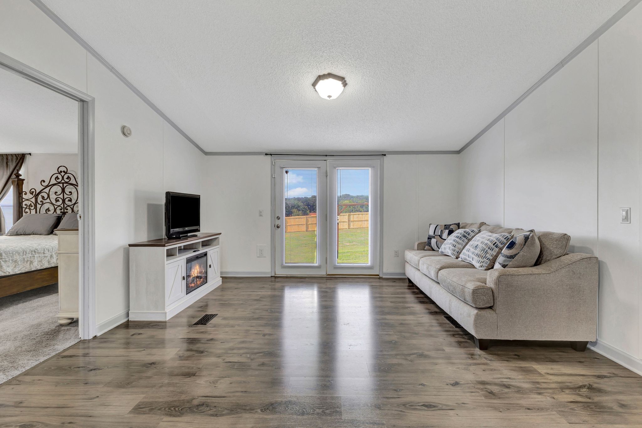 9440 Missionary Ridge Road Bon Aqua, TN 37025 - Photo 7 of 59 a living room with furniture and a flat screen tv