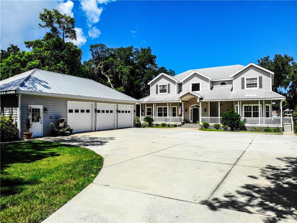 6009 Lafayette Street New Port Richey, FL 34652 - Photo 1 of 1 a front view of a house with a yard