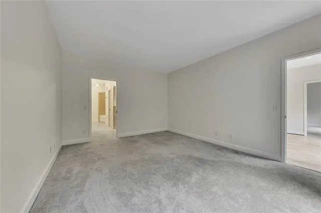 a view of an empty room and a window