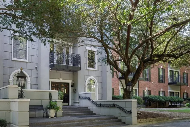 a view of a kitchen with a sink and a refrigerator