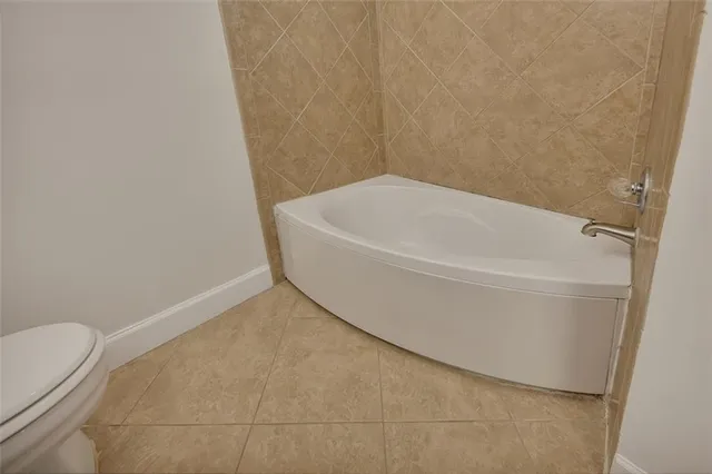 a bathroom with a white bath tub
