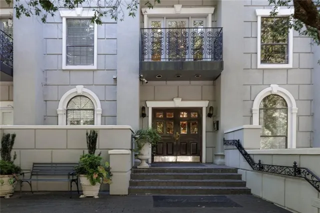 a front view of a house with large windows