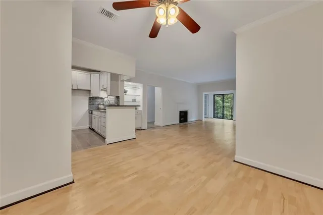 a view of a kitchen with a sink and a refrigerator