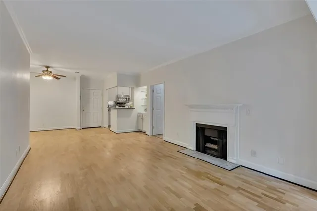 a view of empty room with a fireplace